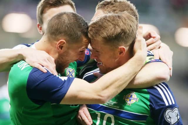 Celebration time after Jamie Ward kicked off the scoring in Belfast. Pic by Pacemaker.