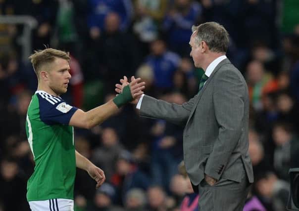 Northern Ireland goal scorer Jamie Ward with manager Michael O'Neill