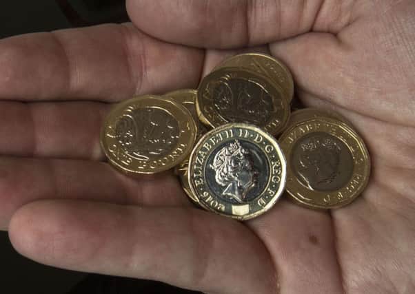 The new Â£1 coin has entered circulation