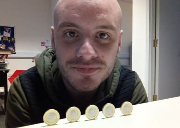 News Letter reporter Stephen Gamble with his rare '2016' Â£1 coins