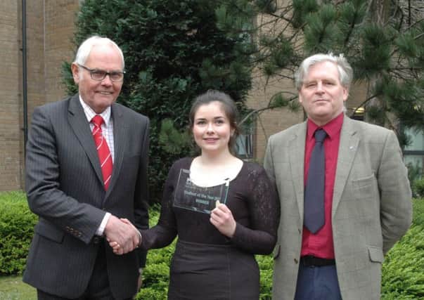 Beef Student of the Year winner, Orla Kelly receives her reward from Beef Shorthorn Societys, Geoff Riby and QMS Stuart Ashworth