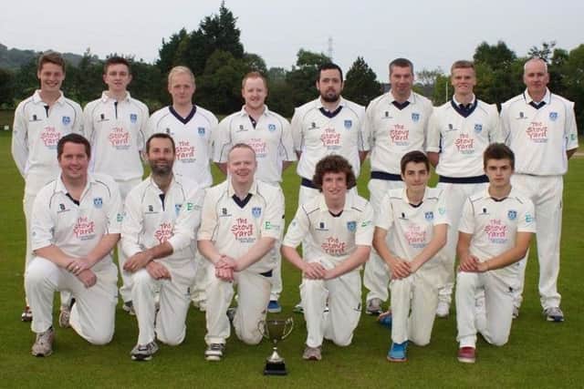John (third from left in the front row) has been with Carrick Cricket Club since he was eight