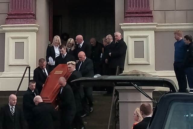 Jack Glenn's heartbroken mother, father and other relatives emerge behind his coffin following his funeral service.
