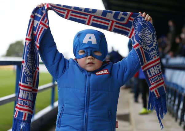 Four-year-old Jack Eakin showing off his colours as 'Captain America' but Stephen Lowry was the real hero for Linfield against Dungannon Swifts as his late goal secured victory at Mourneview Park. Pic by PressEye Ltd.