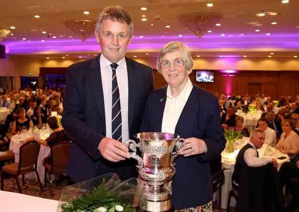 Anne Morrison was awarded the prestigious Belfast Telegraph Cup this year for outstanding agricultural achievement. Pictured accepting the trophy is Anne Morrison, with Barclay Bell, UFU president