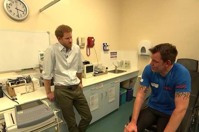 Prince Harry (left) with double amputee Duncan Slater who is preparing to run the Marathon des Sables later this month