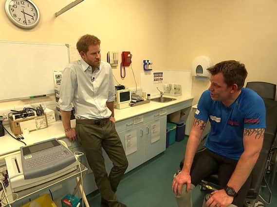 Prince Harry (left) with double amputee Duncan Slater who is preparing to run the Marathon des Sables later this month