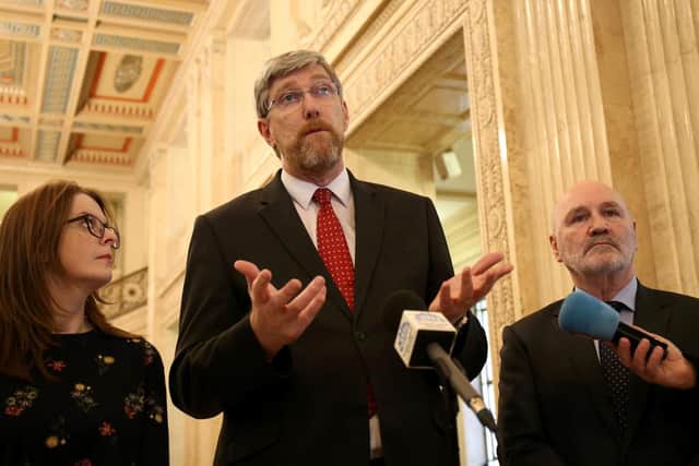 Sinn Fein's Caoimhe Archibald (left), John O'Dowd (centre) and Alex Maskey (right) speak to members of he media in the Great Hall at Stormont Castle in Belfast, where talks aimed at restoring Northern Ireland's powersharing government have resumed.