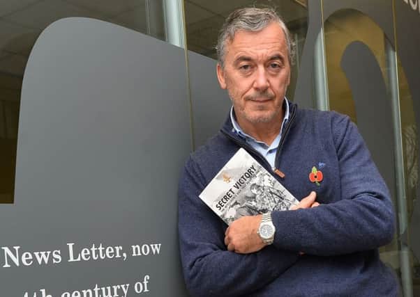 Dr William Matchett at the News Letter Belfast office with his  book Secret Victory: The Intelligence War that Beat the IRA.
Photo Colm Lenaghan/Pacemaker Press