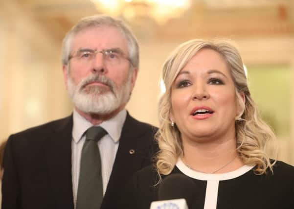 Sinn Fein president Gerry Adams  in the Great Hall, Stormont, as his colleague Michelle O'Neill speaks. Photo: Niall Carson /PA Wire