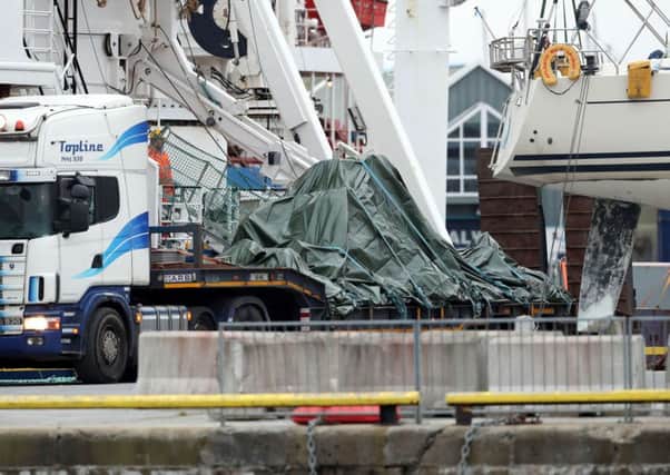 The wreckage of the Irish Coast Guard helicopter, callsign Rescue 116, which crashed off the west coast of Ireland on March 14, leaves Galway harbour on a flat bed truck after the aircraft was recovered from the seabed near Blackrock. Photo: Brian Lawless/PA Wire