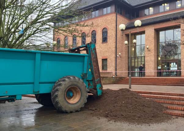 File photo dated 17/1/2017 of workers clear up after muck was sprayed on the steps of Derby Crown Court. Charles Hirons has pleaded guilty at the same court to criminal damage in relation to the incident. PRESS ASSOCIATION Photo. Issue date: Wednesday April 5, 2017. See PA story COURTS Muck. Photo credit should read: Alexander Britton/PA Wire