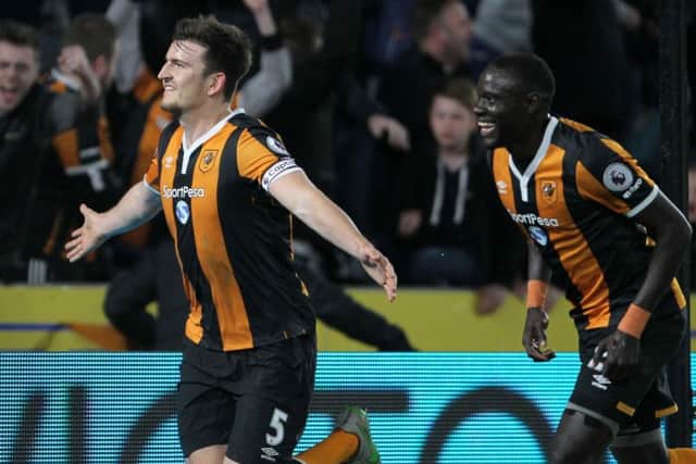 Hull City's Harry Maguire (left) celebrates scoring his side's fourth goal against Middlesborough