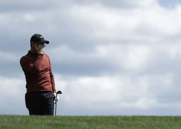 Rory McIlroy  watches his shot on the fourth hole during the first round