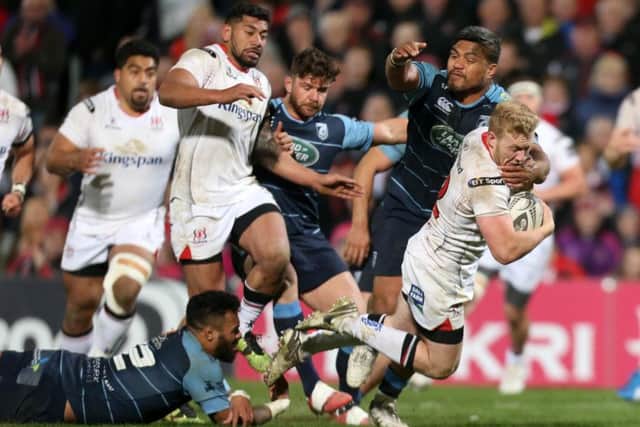 Ulster's Stuart Olding  is tackled by Cardiff's Nick Williams