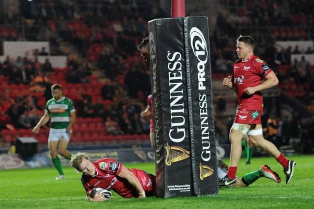 Scarlets' Aled Davies scores his side's eighth try
