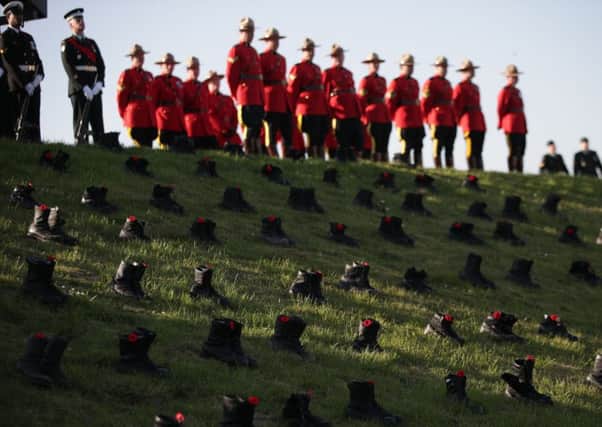 Royal Canadian Mounted Police officers during a commemorative ceremony at Vimy Memorial Park in France, during commemorations for the 100th anniversary of the Battle of Vimy Ridge. PRESS ASSOCIATION Photo. Picture date: Sunday April 9, 2017. The ceremony will honour the sacrifices of Canadian forces and their British counterparts at the four-day battle of Vimy Ridge. See PA story ROYAL Vimy. Photo credit should read: Yui Mok/PA Wire