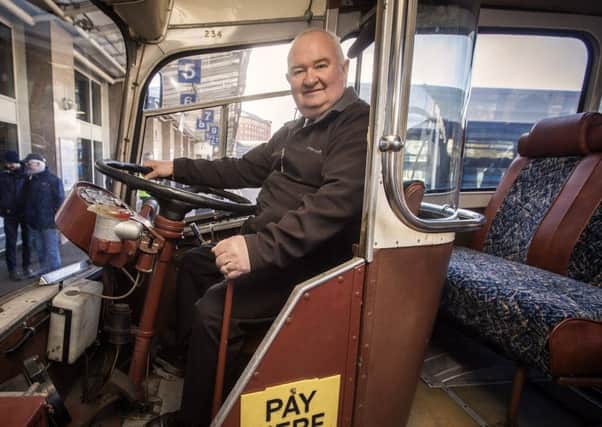 Trevor Dixon, long-serving Ulsterbus driver and former chief driving instructor, aboard a vintage Ulsterbus