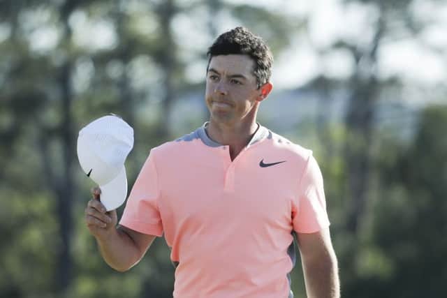 Rory McIlroy of Northern Ireland, tips his hat on the 18th hole during the final round of the Masters