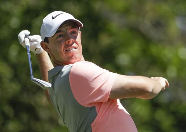 Rory McIlroy, of Northern Ireland, hits from the fourth tee during the final round of the Masters