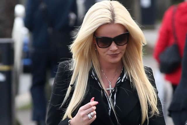 Olivia Danielli, the wife of former Scottish rugby international Simon Danielli, leaves Newtownards court after being found guilty of causing criminal damage to his Jaguar car.