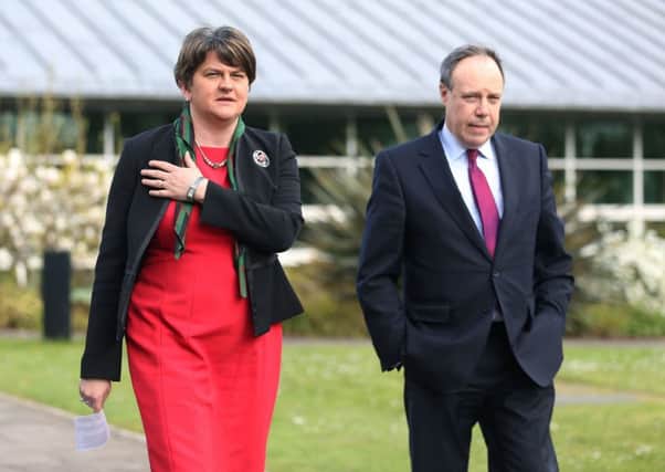 DUP leader Arlene Foster and deputy leader Nigel Dodds arrive to speak to the media, in the grounds of Stormont Castle, after the UK government warned that failure to form a new powersharing executive in Northern Ireland by early May will force another snap election or a return to direct rule from London. PRESS ASSOCIATION Photo. Picture date: Wednesday April 12, 2017. See PA story ULSTER Politics. Photo credit should read: Brian Lawless/PA Wire