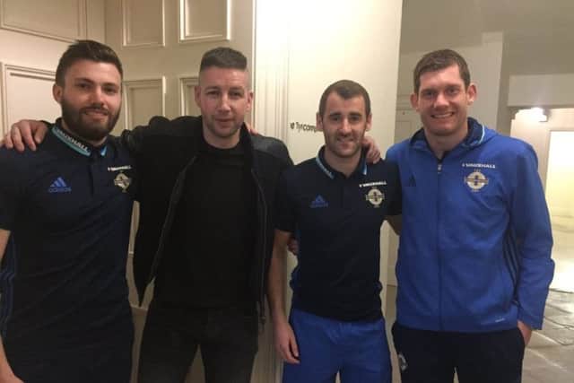 Magician Rodd Hogg (second from left) with Northern Ireland players, from left, Stuart Dallas, Niall McGinn and Michael McGovern. INCR 17-706-CON HOGG