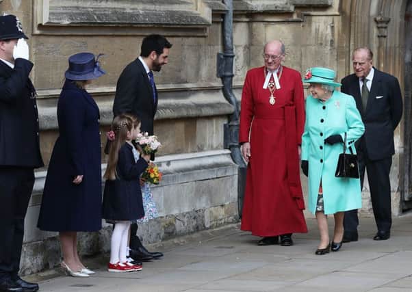 Queen Elizabeth II and the Duke of Edinburgh leave after attending the Easter Sunday service at St George's Chapel at Windsor Castle in Berkshire. Photo: Jonathan Brady/PA Wire