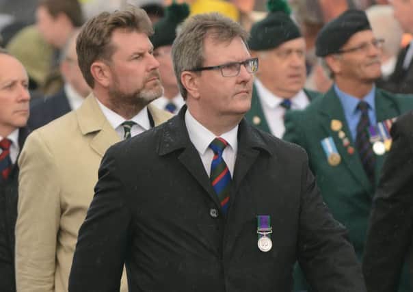 Jeffrey Donaldson at a Somme commemoration last year. Marchs election put the DUP on 28 seats, and Sinn Fein on 27
