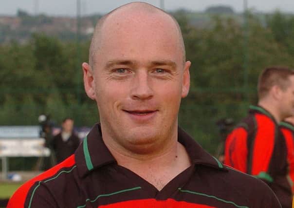 PSNI Constable Peadar Heffron was seriously injured in an ONH bomb attack in 2010. He is pictured here as captain of the PSNI GAA team.