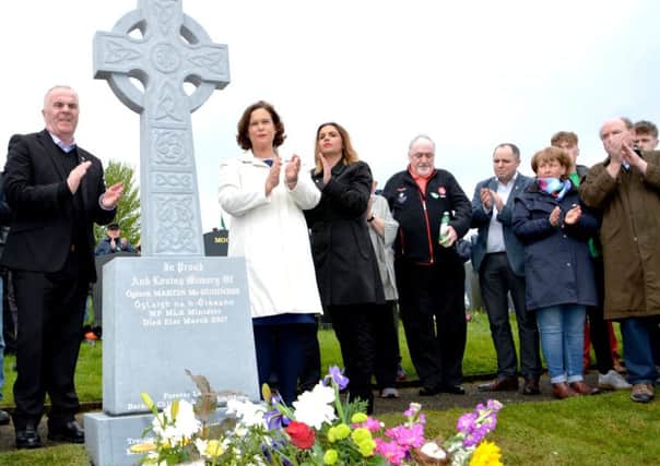 Mary Lou McDonald TD and Foyle MLAs Raymond McCartney and Elisha McCallion unveil a new headstone to Martin McGuinness. Photo: Charlie McMenamin.
