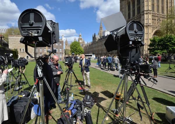 Members of the media on College Green outside the Houses of Parliament in central London, after Prime Minister Theresa May announced a snap general election on June 8. The DUP is set to remain the largest of the NI parties in the Commons. Photo: John Stillwell/PA Wire