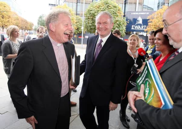 The Reverend David Latimer is welcomed by Martin McGuinness for Sinn Fein's Ard Fheis at Belfast's Waterfront Conference Centre in 2011