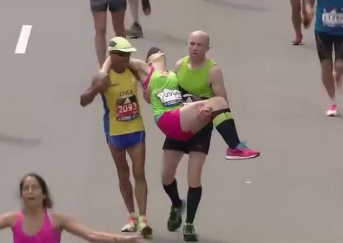 Exhausted Marathon Runner Raw: Exhausted Runner Helped To Finish Line