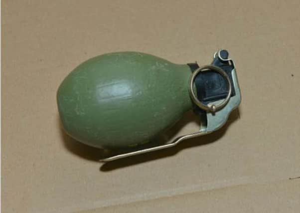 Theresa May has been accused by the SDLP leader Colum Eastwood. of throwing a 'grenade' into the Province's peace process. Pictured is an actual hand grenade, seized in Londonderry in 2012.