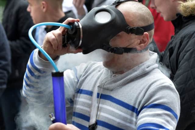 A man inhaling at the LegenDerry Cannabis Club 4/20 cannabis smoke out protest, in Guildhall Square