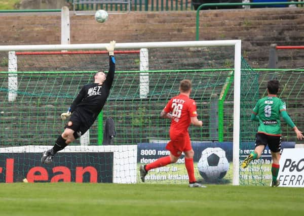 Eric Foley's free-kick delivery evades the dive of Portadown goalkeeper Jack Duffin. Pic by Pacemaker.