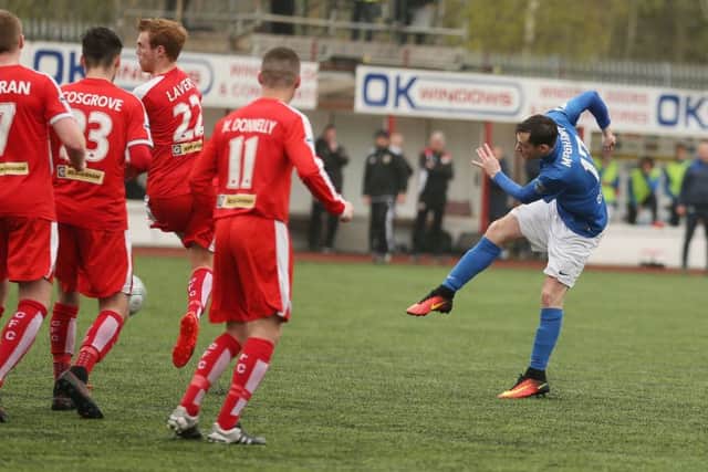 Andy McGrory rams home Glenavon's third to cap a miserable day for the hosts at Solitude. Picture by Brian Little/PressEye