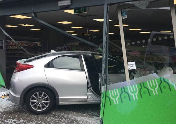 A car has crashed through the front of a shop on Lisburn Road, Belfast. Pic by Deric Henderson