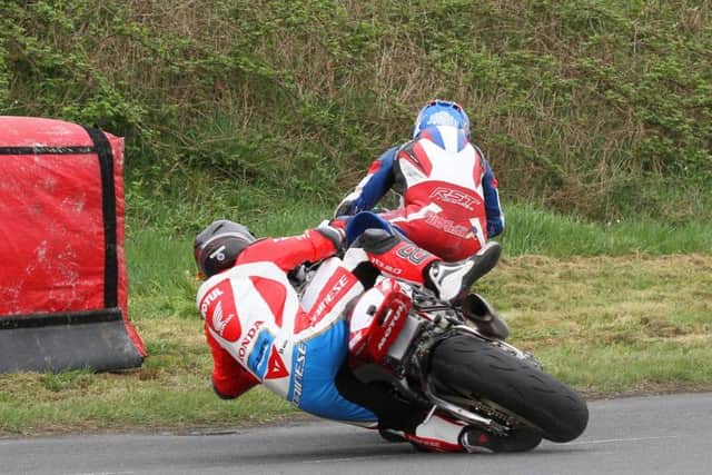 Honda Racing's Guy Martin crashed out of the first Superbike race at the Tandragee 100 after tangling with Paul Jordan at Marlacoo corner.