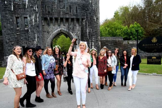 Bride to be Aiofe Power (centre ) stops with her hen party outside Ashford Castle in Co Mayo, where Golf star Rory McIlroy and fiancee Erica Stoll are anticipated to get married.