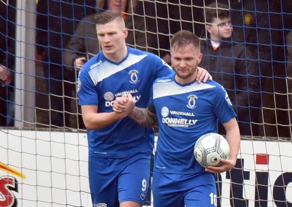 Ryan Harpur (right) following Dungannon Swifts' third goal in the victory over Carrick Rangers. Pic by PressEye Ltd.