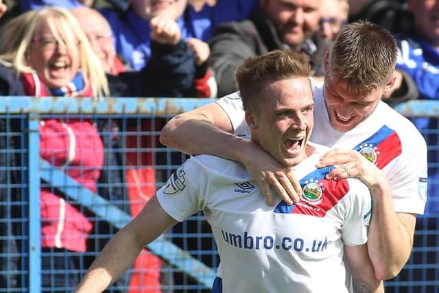 Aaron Burns, who scored two on Saturday, celebrates with Stevie Lowry. 

Photo Lorcan Doherty / Presseye.com