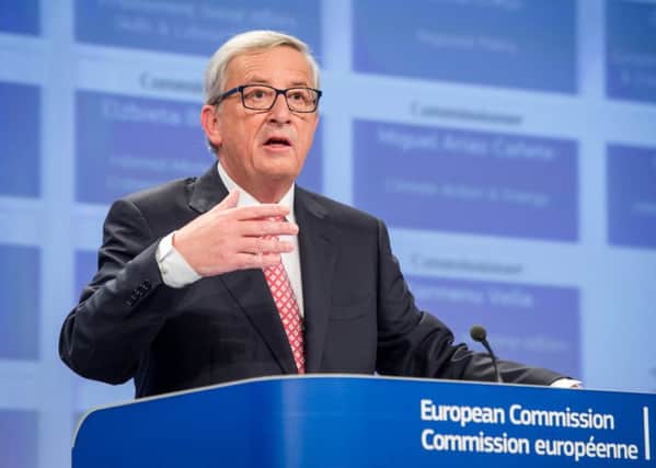 European Commission President elect Jean-Claude Juncker gestures as he addresses the media on the attribution of portfolios to the Commissioners-designate at the European Commission headquarters in Brussels on Wednesday, Sept. 10, 2014. (AP Photo/Geert Vanden Wijngaert)