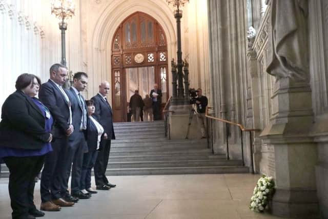 Families of the soldiers killed in the IRA bombing in Hyde Park in 1982, and survivor Simon Utley (right), laying a wreath in Westminster Hall in London at the launch of a campaign to raise funds to bring a case against "chief suspect" John Downey. PRESS ASSOCIATION Photo. Picture date: Tuesday April 25, 2017. See PA story POLITICS HydePark. Photo credit should read: Philip Toscano/PA Wire