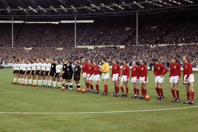 The England and West Germany football teams lining up before the 1966 World Cup final.  Picture PA.