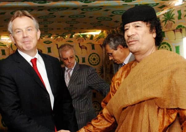 Former prime minister Tony Blair meeting Libyan leader Colonel Gaddafi in Libya in 2007