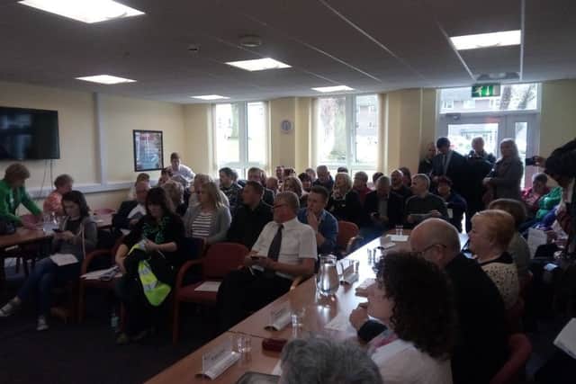 Inside a packed board room of the Southern Health and Social Care Board at a meeting to discuss the future of Daisy Hill Hospital