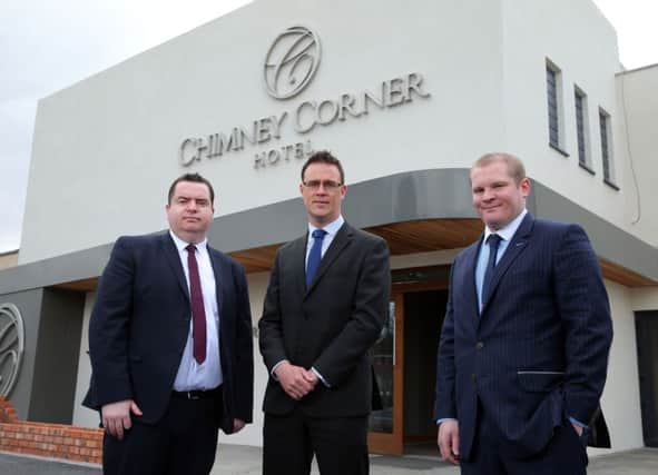 Andy Tew and Gordon Davidson of Ulster Bank, left and centre, with Christopher Kearney, Loughview Leisure Group finance director