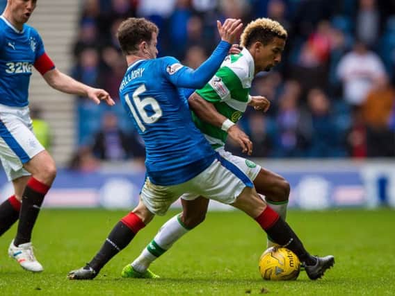 Rangers' Andy Halliday and Celtic's Scott Sinclair compete for the ball during the Ladbrokes Scottish Premiership match at the Ibrox Stadium